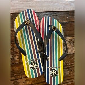Tory Burch flip flips. Multi color bottom. Navy strap. Size 8. NWT